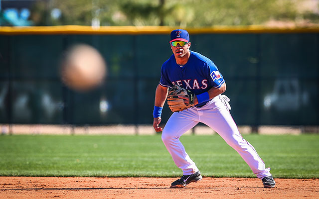 Russell Wilson flashes some leather for the Rangers during drills in 2014. (USATSI)