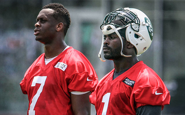 Could Michael Vick (right) beat Chris Johnson in a race? (USATSI)