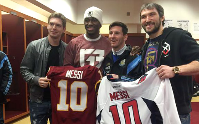 LOOK: Robert Griffin III presents Lionel Messi with Redskins