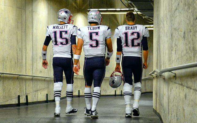 Will Ryan Mallett and Tom Brady still be Tim Tebow's teammates after Saturday?. (USATSI)