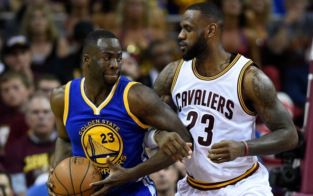 Draymond Green reminds LeBron about their bet with a gentle elbow.