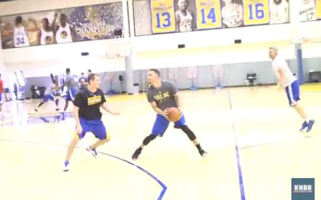 Curry tries to score in his new shooting drill.