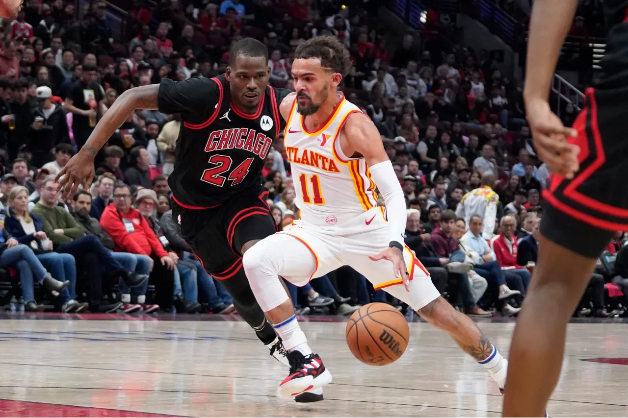 Chicago Bulls guard Javonte Green (24) defends Atlanta Hawks guard Trae Young (11) during the second half during a play-in game of the 2024 NBA playoffs at United Center