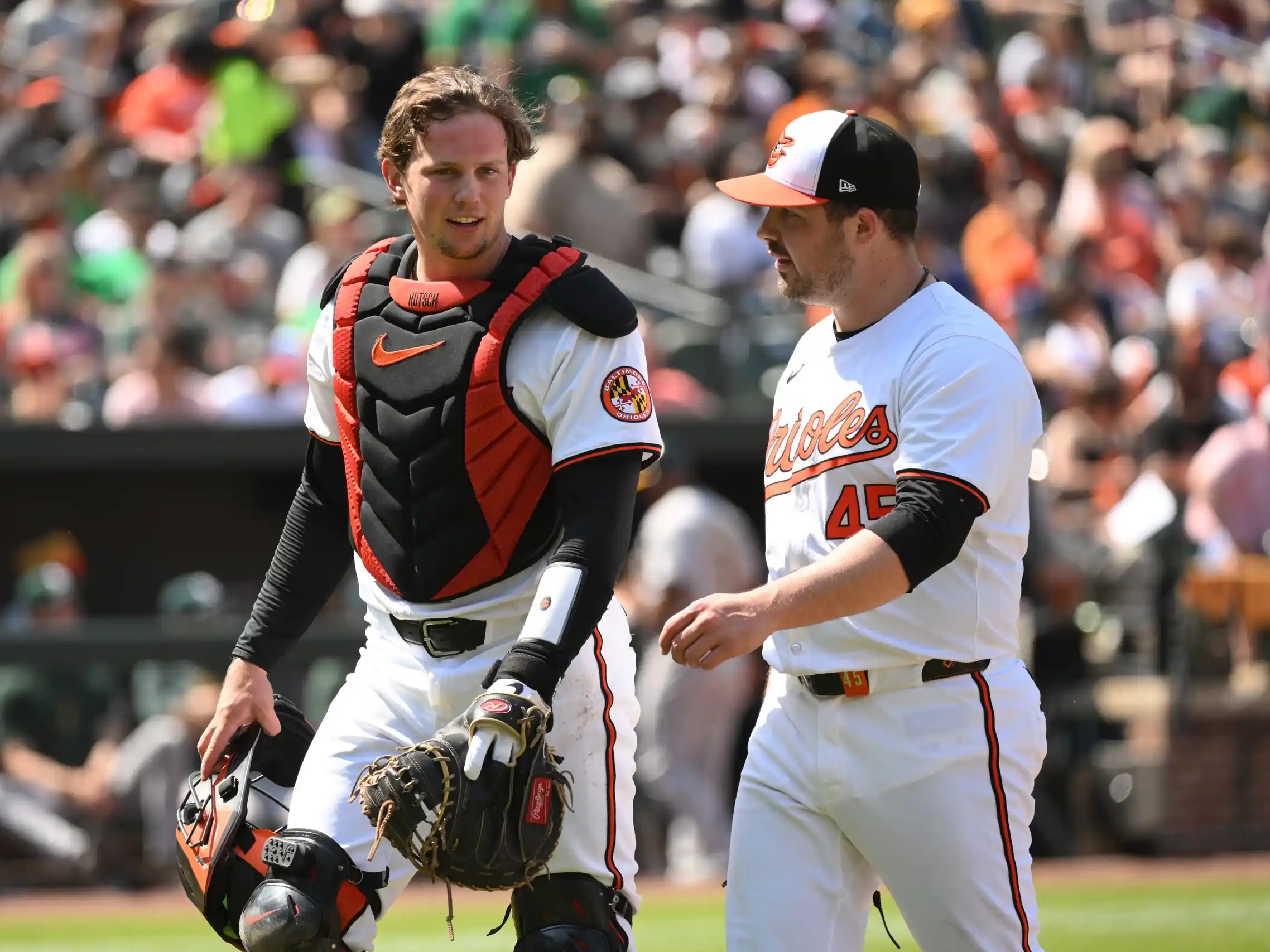 Baltimore Orioles catcher Adley Rutschman (35) and pitcher Jacob Webb (71) react during the ninth inning against the Oakland Athletics at Oriole Park at Camden Yards.