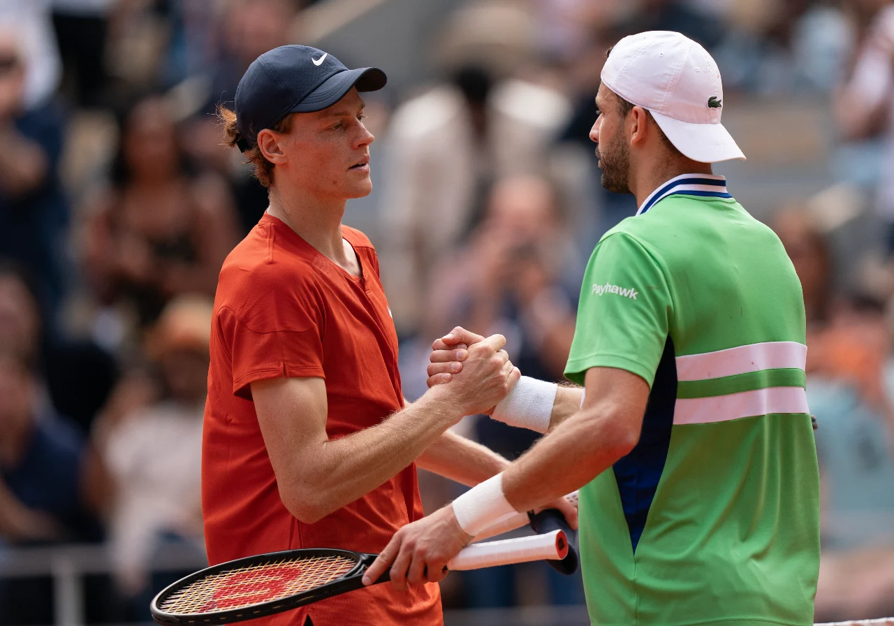 Paris, France; Jannik Sinner of Italy shakes hands with Grigor Diitrov of Bulgaria after their match on day 10 of Roland Garros at Stade Roland Garros.