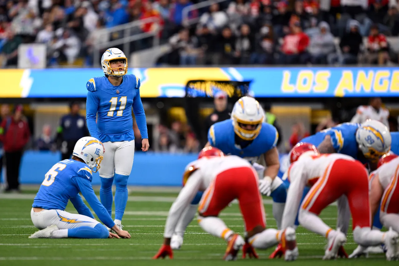 Los Angeles Chargers place kicker Cameron Dicker (11) prepares to kick a field goal against the Kansas City Chiefs during the second half at SoFi Stadium.