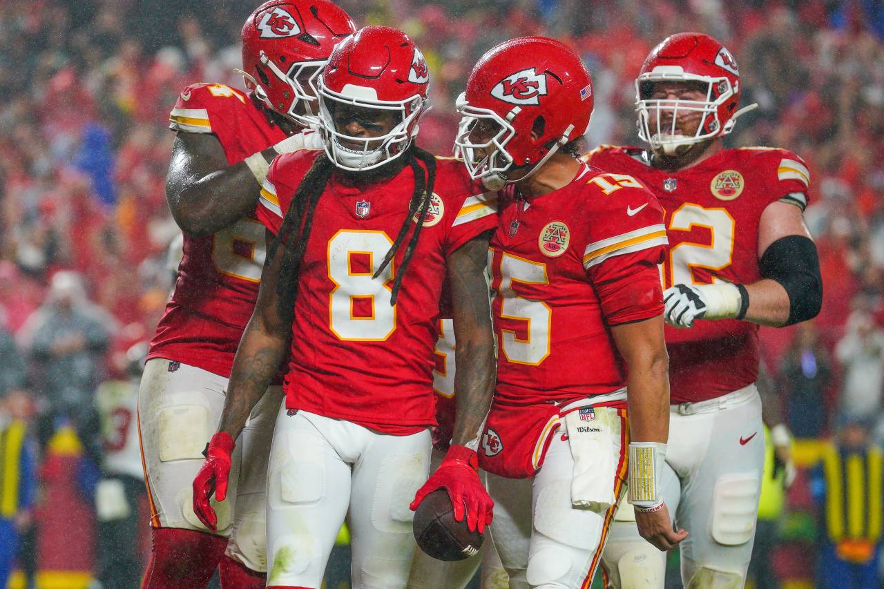 Kansas City Chiefs wide receiver DeAndre Hopkins (8) celebrates with quarterback Patrick Mahomes (15) after scoring against the Tampa Bay Buccaneers during the game at GEHA Field at Arrowhead Stadium.