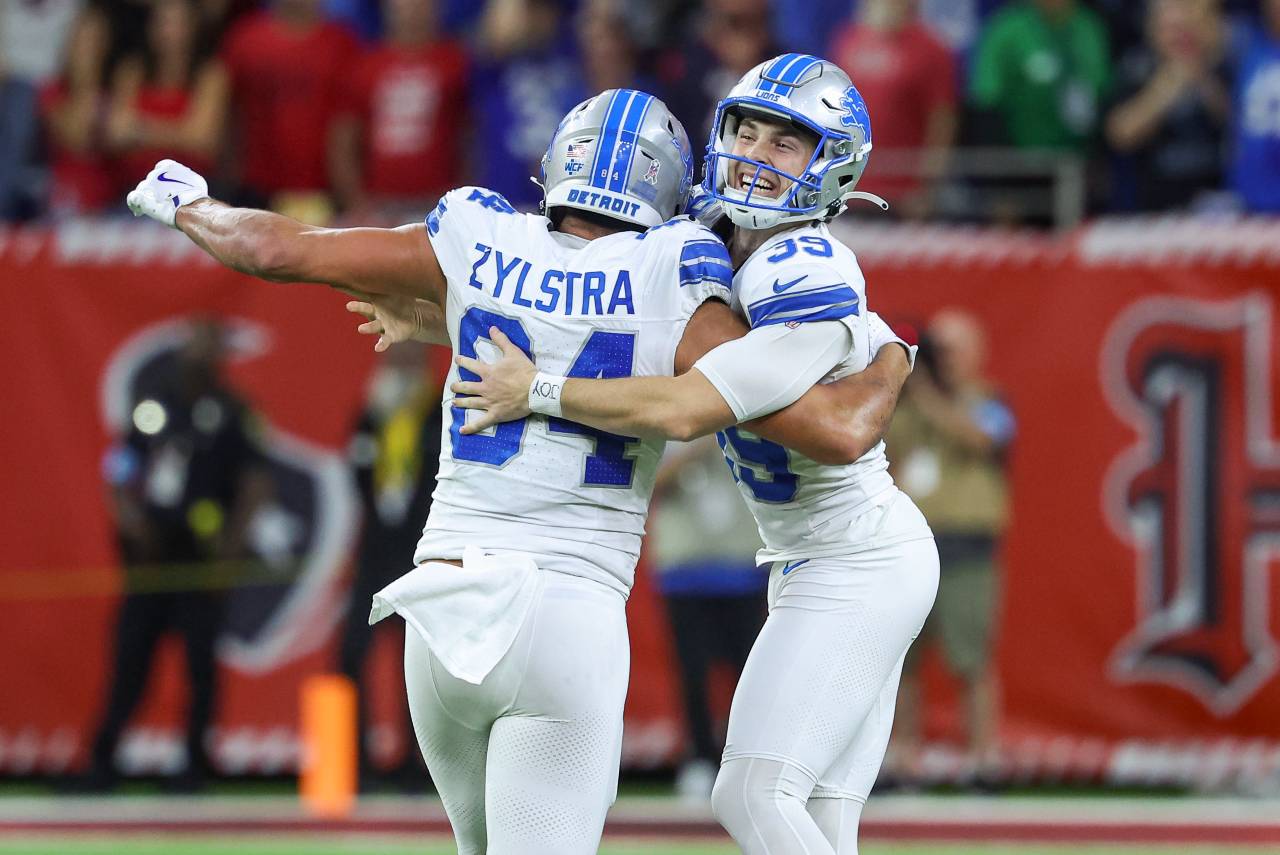 Detroit Lions place kicker Jake Bates (39) celebrates with tight end Shane Zylstra (84) after kicking a field goal with time expiring to give the Lions a win over the Houston Texans at NRG Stadium.