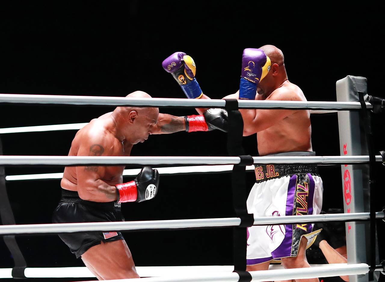 Mike Tyson (black trunks) fights Roy Jones, Jr. (white trunks) during a heavyweight exhibition boxing bout for the WBC Frontline Belt at the Staples Center.